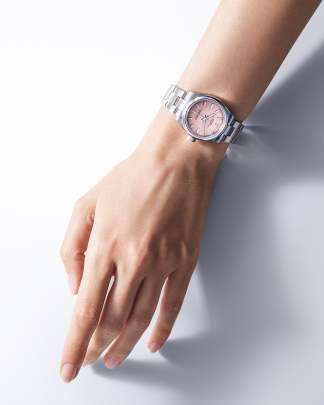 Rolex Oyster Perpetual watch featuring a pink dial and an Oyster bracelet.  Rolex